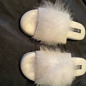 Comfortable and beautiful white furry slippers. Size small.